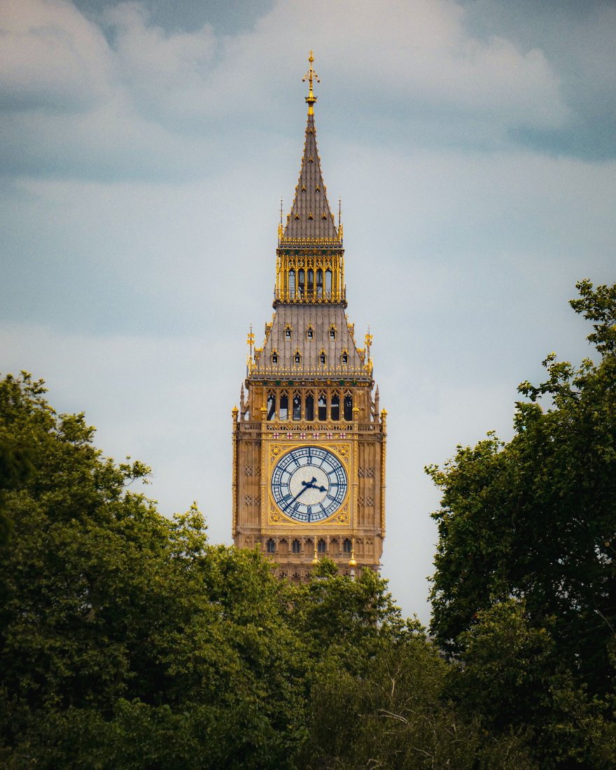 Big Ben above the trees in Westminster, London